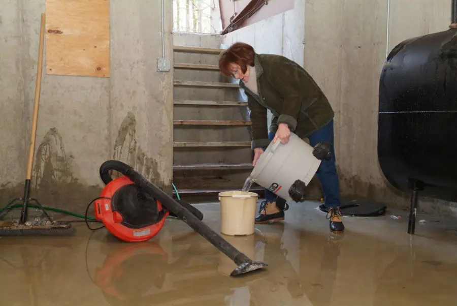 Technician extracting standing water from a floor in a Stamford, CT home